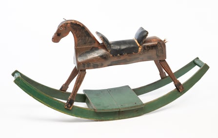 AMERICAN CARVED AND PAINTED WOOD ROCKING HORSE.