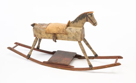 AMERICAN CARVED AND PAINTED WOOD ROCKING HORSE.