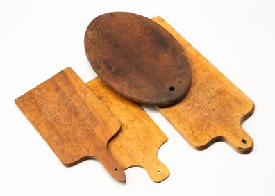 FOUR DIMINUTIVE CUTTING BOARDS.