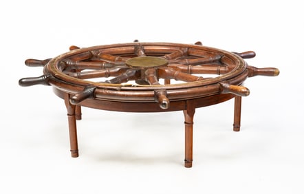 BRASS-MOUNTED TEAK AND MAHOGANY PILOT WHEEL COFFEE TABLE.