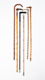 COLLECTION OF BAMBOO CANES, INCL. STERLING SILVER-MOUNTED EXAMPLE.