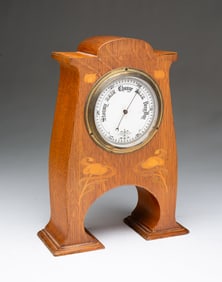 AMERICAN ART NOUVEAU OAK AND MARQUETRY TABLETOP BAROMETER.