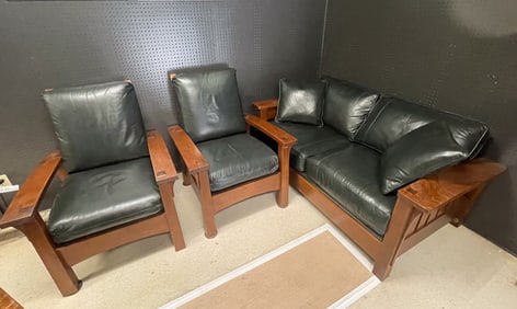 STICKLEY (MANLIUS, NEW YORK) ARTS AND CRAFTS STYLE OAK AND LEATHER LOVESEAT PLUS TWO MORRIS CHAIRS.