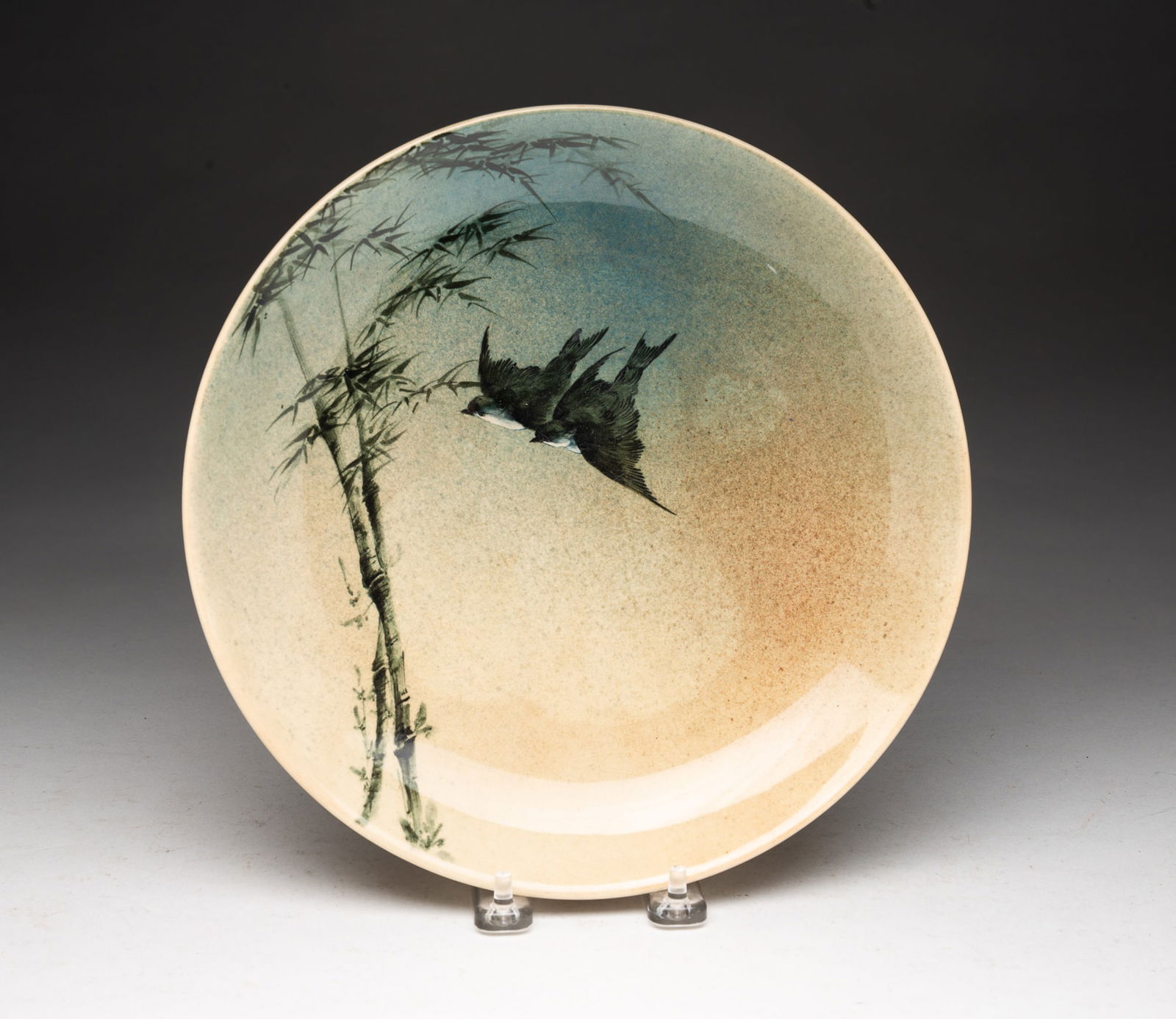 ROOKWOOD POTTERY CO. (CINCINNATI, OHIO) BIRD-DECORATED BOWL.: Rookwood Pottery Co. (Cincinnati, Ohio), Late 19th Century. Round with birds and bamboo trees and signed Rookwood on bottom with artist signature. 10.25"d.