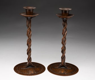 PAIR OF CARL SORENSEN (DANISH, 1893-1979) ARTS AND CRAFTS HAMMERED AND TWISTED COPPER CANDLESTICKS.