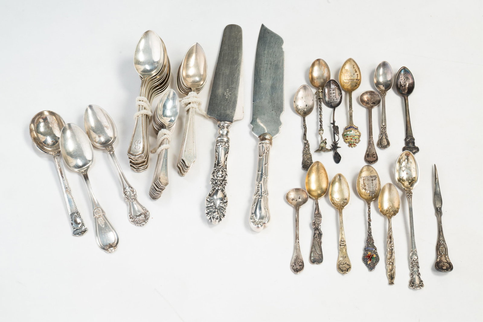 GROUP OF STERLING INCLUDING DEMITASSE SOUVENIR SPOONS.: Twentieth Century. Makers include International, Reed and Barton, Dominick and Haff, Tiffany "San Lorenzo" spoon and others. Approximately 27 ozt.
