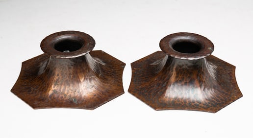 PAIR OF ROYCROFT (EAST AURORA, NEW YORK) ARTS AND CRAFTS HAMMERED COPPER CANDLESTICKS.