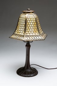 HANDEL (MERIDEN, CONNECTICUT) ARTS AND CRAFTS PATINATED METAL AND SLAG GLASS BOUDOIR LAMP.