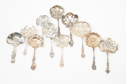 ELEVEN AMERICAN STERLING SILVER BON BON SCOOPS.