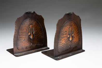 PAIR OF CARL SORENSEN (DANISH, 1893-1979) ARTS AND CRAFTS HAMMERED COPPER BOOKENDS.