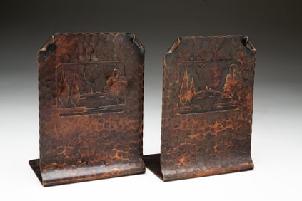 PAIR OF CARL SORENSEN (DANISH, 1893-1979) ARTS AND CRAFTS HAMMERED COPPER BOOKENDS.