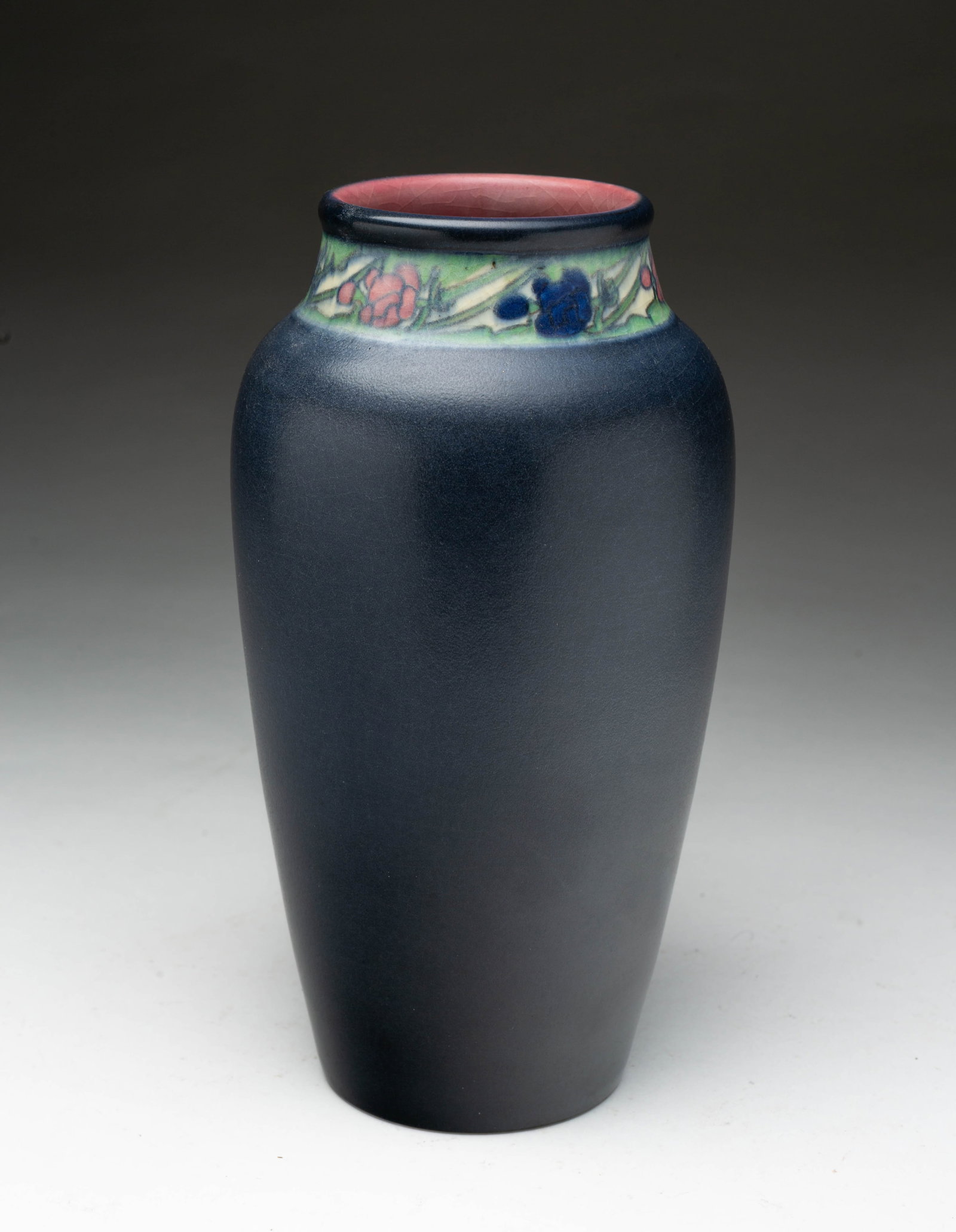 CARRIE STEINLE (ACTIVE 1892-1925) FOR ROOKWOOD POTTERY CO. (CINCINNATI, OHIO) GLAZED VASE, DATED: Carrie Steinle (American, active 1892-1925) for Rookwood Pottery Company (Cincinnati, Ohio), 1917. Of slender ovoid form with slightly flared top rim, having a deep blue body with a band of polychrome