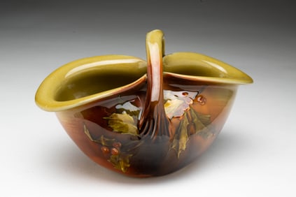 HARRIET R. STRAFER (1873-1935) FOR ROOKWOOD POTTERY CO. (CINCINNATI, OHIO) HOLLY-DECORATED BASKET.