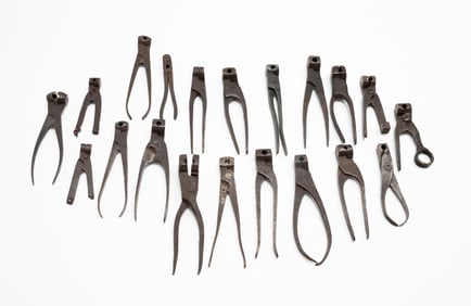 TWENTY IRON SCISSOR BULLET MOLDS.