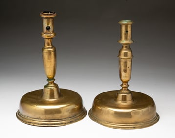 TWO EUROPEAN BRASS CAPSTAN CANDLESTICKS.