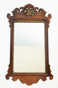 AMERICAN CHIPPENDALE STYLE SCROLL-CUT MAHOGANY AND PARCEL-GILT MIRROR.