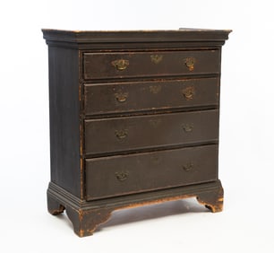 NEW ENGLAND CHIPPENDALE REDDISH-BLACK PAINTED PINE FOUR-DRAWER CHEST.