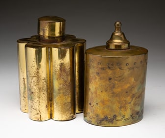 TWO ENGLISH BRASS TEA CADDIES.