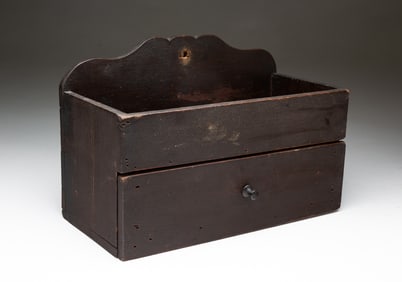 AMERICAN BROWN-PAINTED PINE HANGING CANDLE BOX WITH DRAWER.