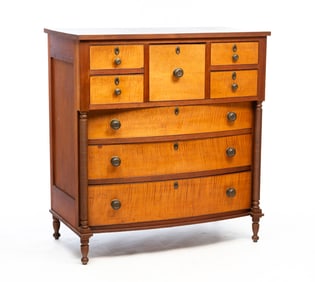 AMERICAN TRANSITIONAL TIGER MAPLE AND CHERRY EIGHT-DRAWER BONNET CHEST.