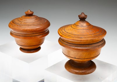 TWO DIMINUTIVE PEASEWARE LIDDED JARS.