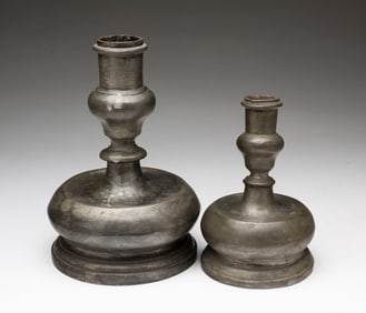 TWO EUROPEAN PEWTER CAPSTAN CANDLESTICKS.