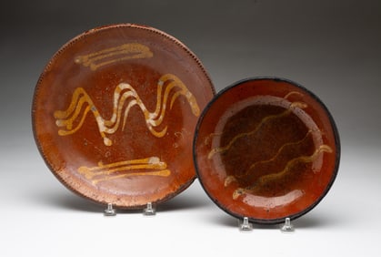 TWO PENNSYLVANIA REDWARE PLATES.