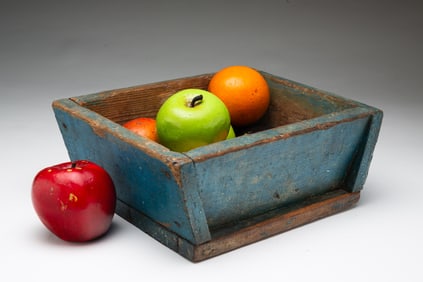 AMERICAN BLUE-PAINTED GRAIN MEASURE FILLED WITH PAINTED WOOD FRUIT.