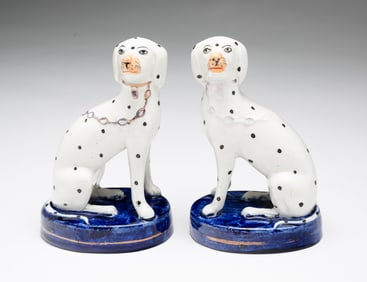 PAIR OF STAFFORDSHIRE SEATED DALMATIANS.