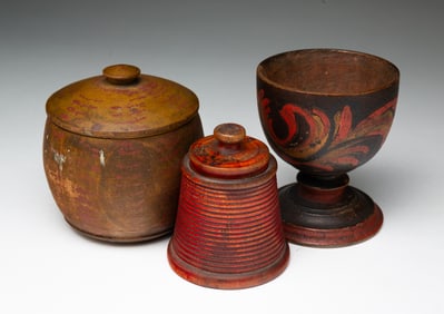 LEHNWARE FOOTED OPEN CUP AND TWO PAINT-DECORATED TREENWARE LIDDED JARS.