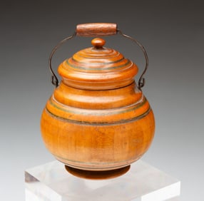 DIMINUTIVE POLYCHROME-DECORATED TREENWARE LIDDED JAR WITH BAIL HANDLE.