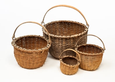FOUR AMERICAN GRADUATED BASKETS WITH SWING HANDLES.