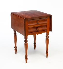 AMERICAN TRANSITIONAL CHERRY AND MAHOGANY TWO-DRAWER DROP-LEAF STAND.