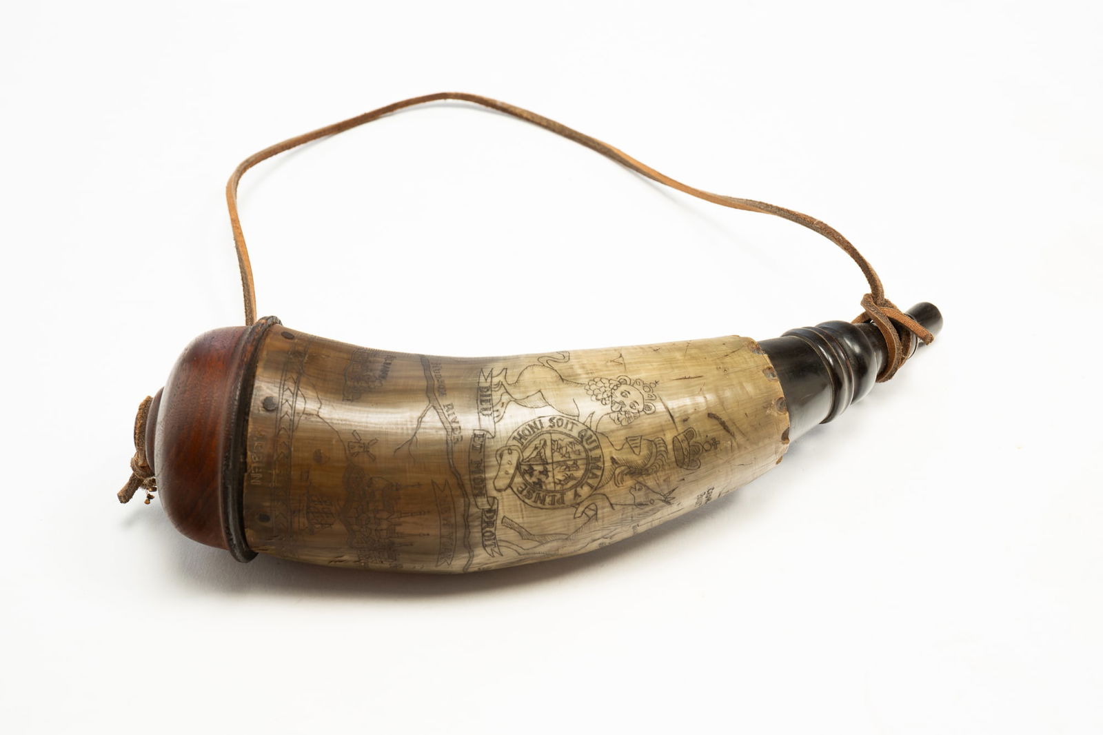 AMERICAN POWDER HORN WITH EXTENSIVE ENGRAVING.: America, 20th Century. Horn engraved with a large crest, sprawling map of the East Coast including New York, Lake Champlain, the Hudson River and more. Signed "D. Hill". With wooden end cap and plug.