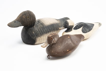 THREE AMERICAN CARVED AND PAINTED DUCK DECOYS.