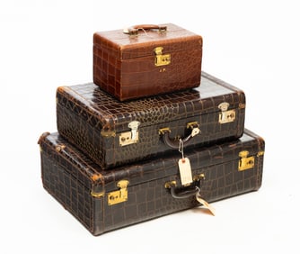 THREE MONOGRAMMED ALLIGATOR AND COW HIDE SUITCASES.
