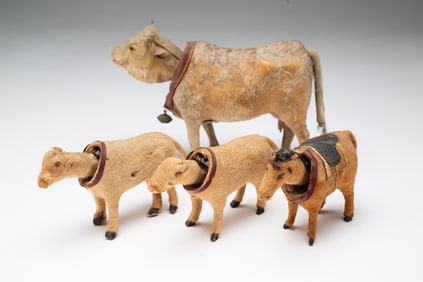 FOUR GERMAN NODDING COW AND HORSE FIGURINES.