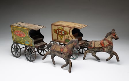 TWO TIN LITHOGRAPHED HORSE AND WAGON TOYS.