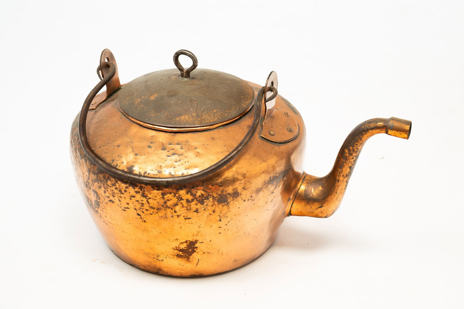 LARGE AMERICAN COPPER TEA KETTLE.: American, 19th Century. Having a goose neck, dovetailed body, and iron handle. 13"h. 14"w.Provenance: From the Lifetime Collection of the late Joanne & David Hill (Arcanum, Ohio).