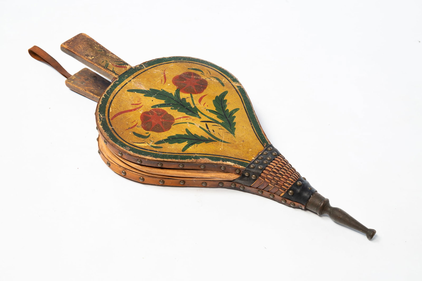 AMERICAN STENCILED AND PAINT-DECORATED BELLOWS.: American, 19th Century. Yellow ground with flower stenciling and brass tack trim, 18"l.Provenance: From the Lifetime Collection of the late Joanne & David Hill (Arcanum, Ohio).