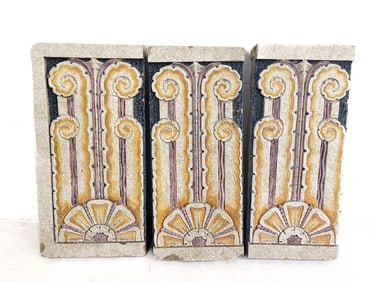 THREE ART DECO POLYCHROME GLAZED TERRACOTTA ARCHITECTURAL RELIEF PANELS.