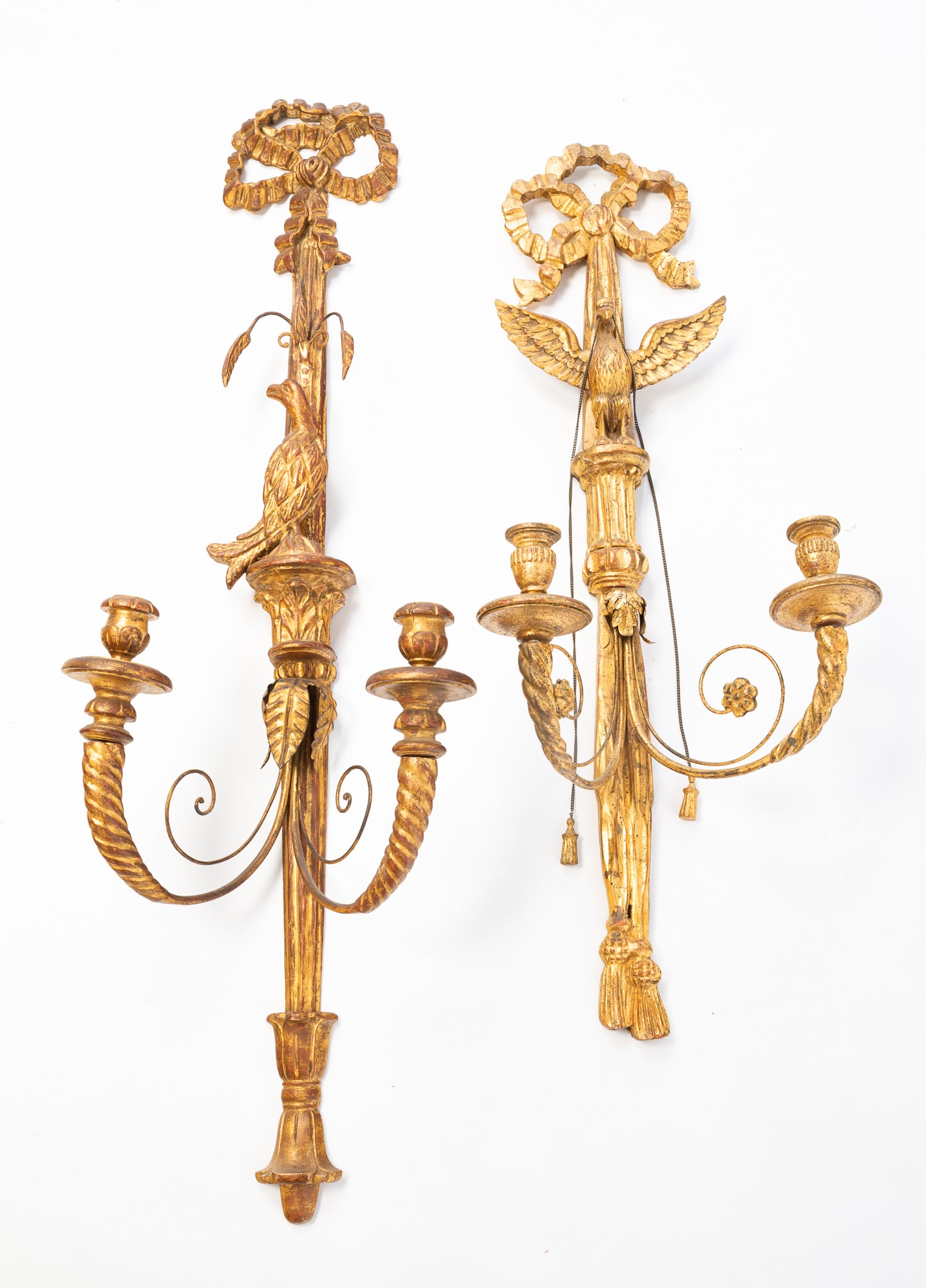TWO CARVED WOOD LOUIS XVI STYLE ITALIAN WALL SCONCES.: American, Early 20th Century. Gilt wood. Sconces with tied bow to the top, birds and leaces each with two sockets and round bobeche. 36.5"h. and 45"h.