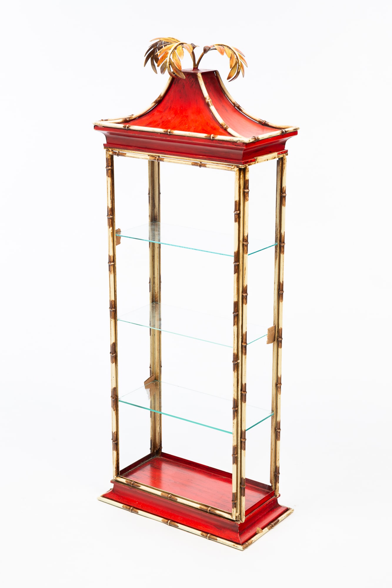 PAINTED METAL AND GLASS CHINOISERIE ETAGERE.: American, 20th Century. Painted metal case with bamboo style frame and leaf finial. Open front and back with three glass shelves and glass sides. 30.75"h. 14.75"w. 8.25"d.