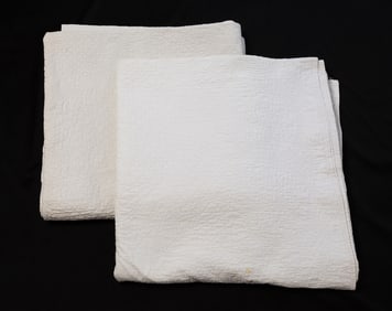 TWO AMERICAN HAND-STITCHED WHITEWORK BRIDE'S QUILTS.