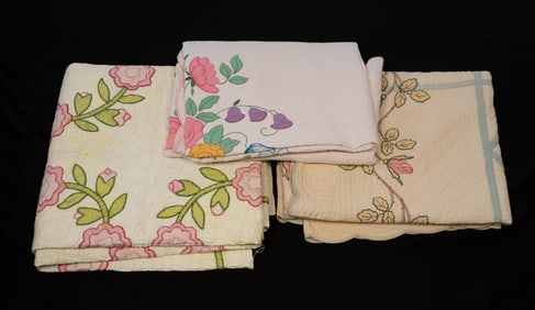 THREE AMERICAN APPLIQUÉ AND HAND-STITCHED QUILTS.