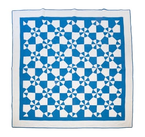 AMERICAN HAND-STITCHED PIECED PINWHEEL QUILT.