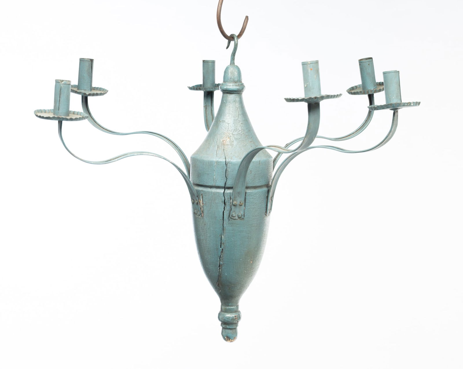 FOLKSY PAINTED WOOD AND TIN FIVE ARM CANDLE CHANDELIER.: American, 19th Century. Central wood body with eight curved tin arms ending in bobeche and candle cups in all over blue paint. Hook to top for hanging. Square nail construction. 19"h.
