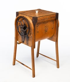 M. BROWN AND COMPANY (WAPAKONETA, OHIO) IRON-MOUNTED OAK BUTTER CHURN.