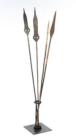 FOUR AFRICAN TRIBAL SPEARS WITH STAND.