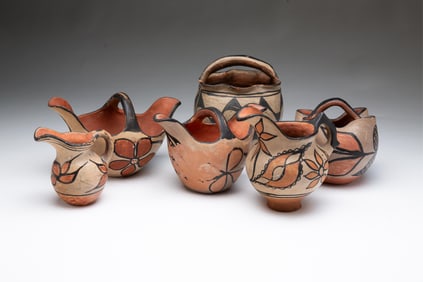 SIX HANDLED NATIVE AMERICAN PUEBLO DECORATED POTTERY VESSELS.